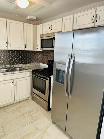 a view of an empty room and a window