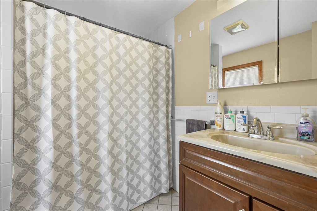 50 Temple Street, Unit 50 Somerville, MA 02145 - Photo 18 of 41 a bathroom with a sink and a mirror