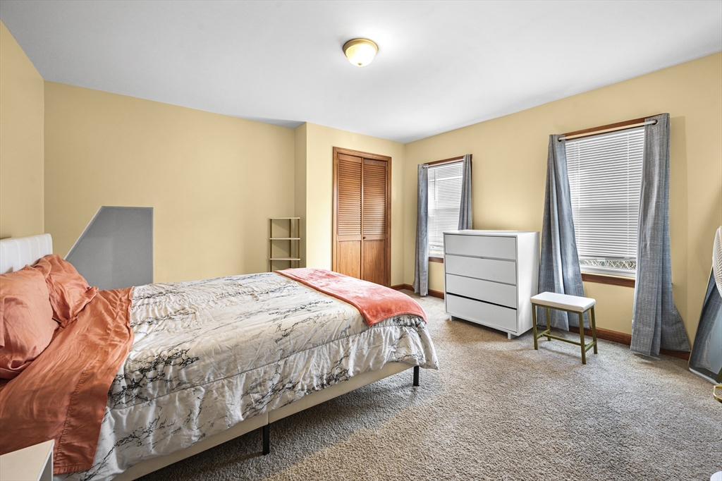 50 Temple Street, Unit 50 Somerville, MA 02145 - Photo 19 of 41 a bedroom with a bed and a desk