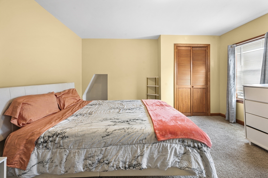 50 Temple Street, Unit 50 Somerville, MA 02145 - Photo 20 of 41 a bedroom with a bed and a window