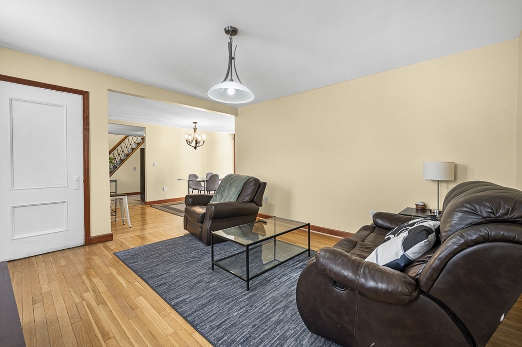 50 Temple Street, Unit 50 Somerville, MA 02145 - Photo 2 of 41 a living room with furniture and a wooden floor