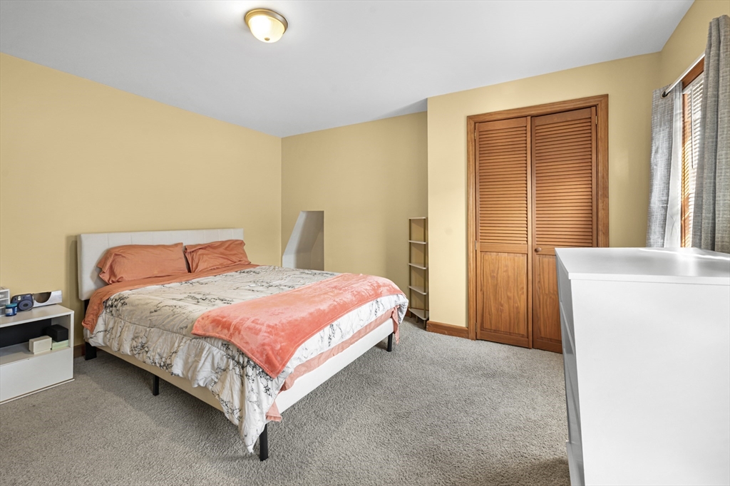 50 Temple Street, Unit 50 Somerville, MA 02145 - Photo 21 of 41 a bedroom with a bed and a window