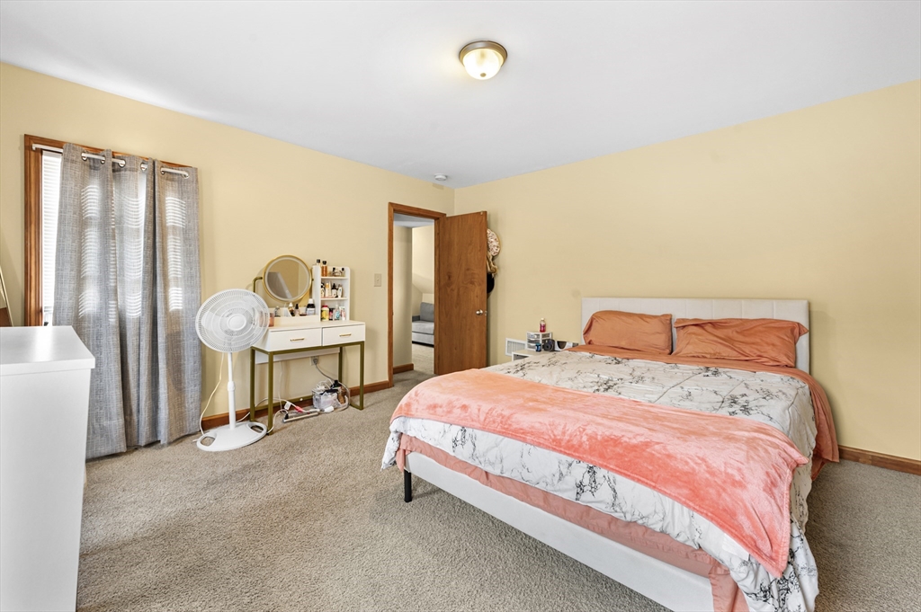50 Temple Street, Unit 50 Somerville, MA 02145 - Photo 23 of 41 a bedroom with a bed and a cabinets