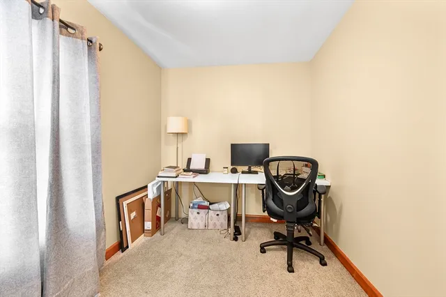 a view of a workspace with furniture