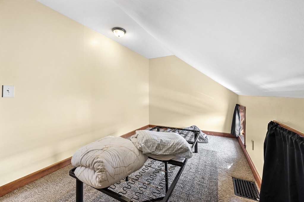 50 Temple Street, Unit 50 Somerville, MA 02145 - Photo 30 of 41 a bedroom with furniture and a gate