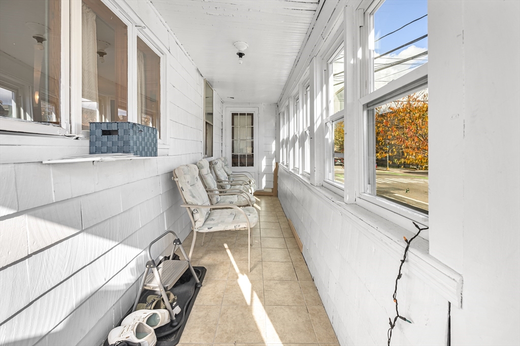 50 Temple Street, Unit 50 Somerville, MA 02145 - Photo 32 of 41 a living room with furniture and a large window