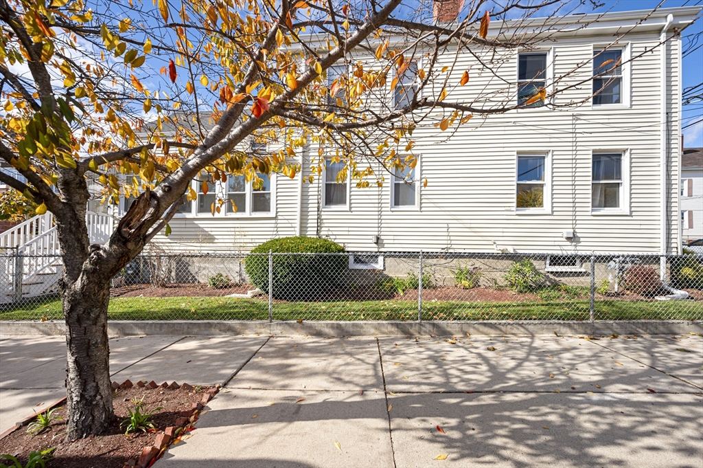 50 Temple Street, Unit 50 Somerville, MA 02145 - Photo 33 of 41 a view of a house with a yard