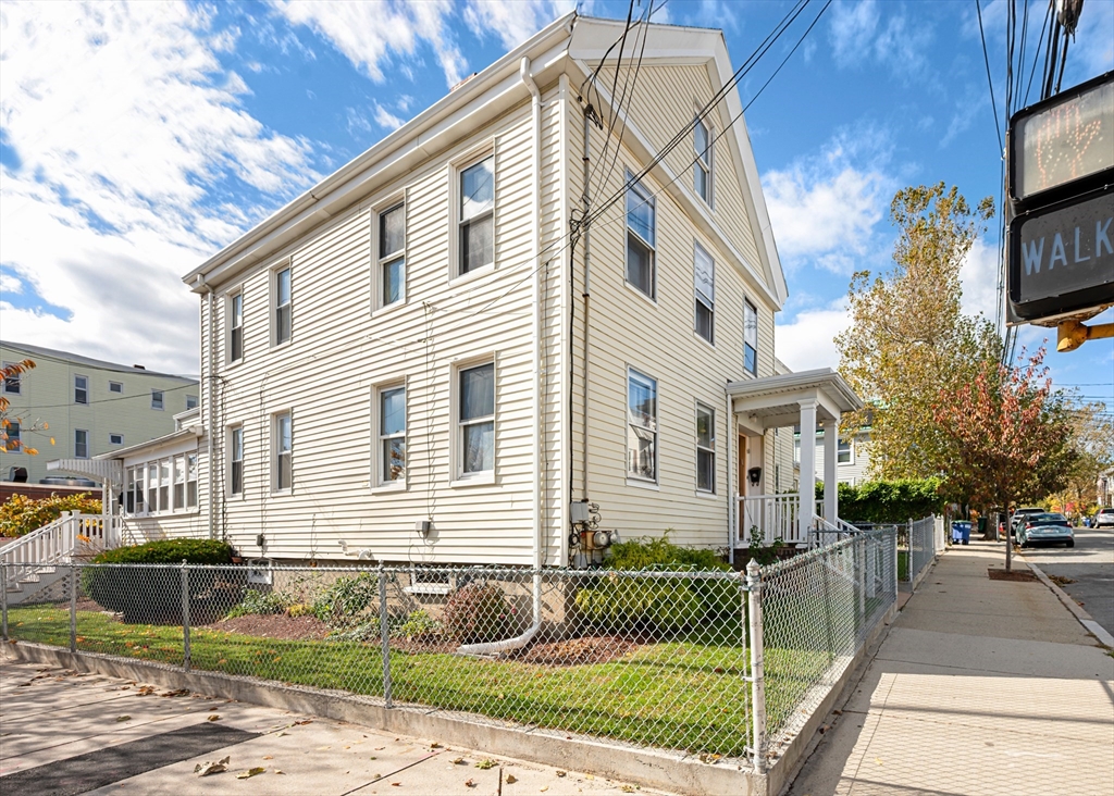 50 Temple Street, Unit 50 Somerville, MA 02145 - Photo 34 of 41 a front view of a house with a yard