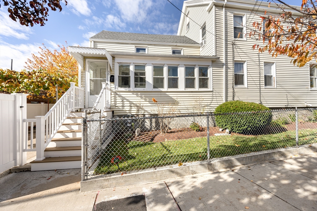 50 Temple Street, Unit 50 Somerville, MA 02145 - Photo 35 of 41 a front view of a house with a garden