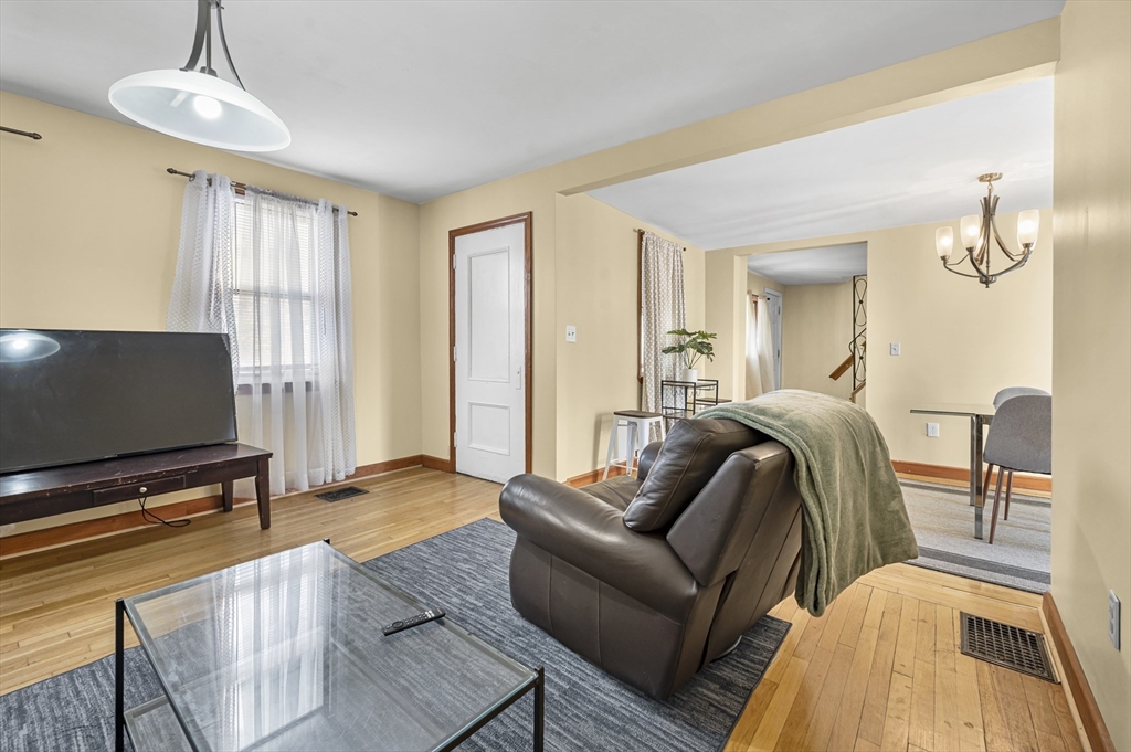 50 Temple Street, Unit 50 Somerville, MA 02145 - Photo 4 of 41 a living room with furniture and a flat screen tv