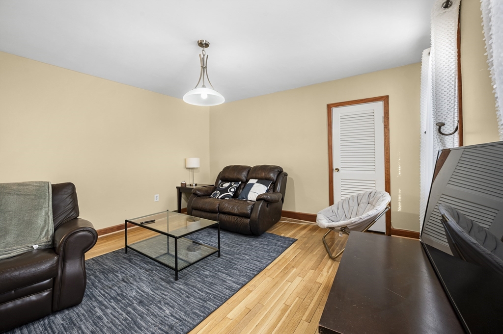 50 Temple Street, Unit 50 Somerville, MA 02145 - Photo 5 of 41 a living room with furniture and a wooden floor