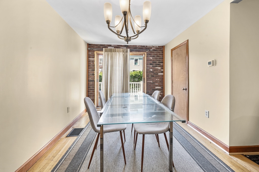 50 Temple Street, Unit 50 Somerville, MA 02145 - Photo 7 of 41 a view of a dining room with furniture window and outside view