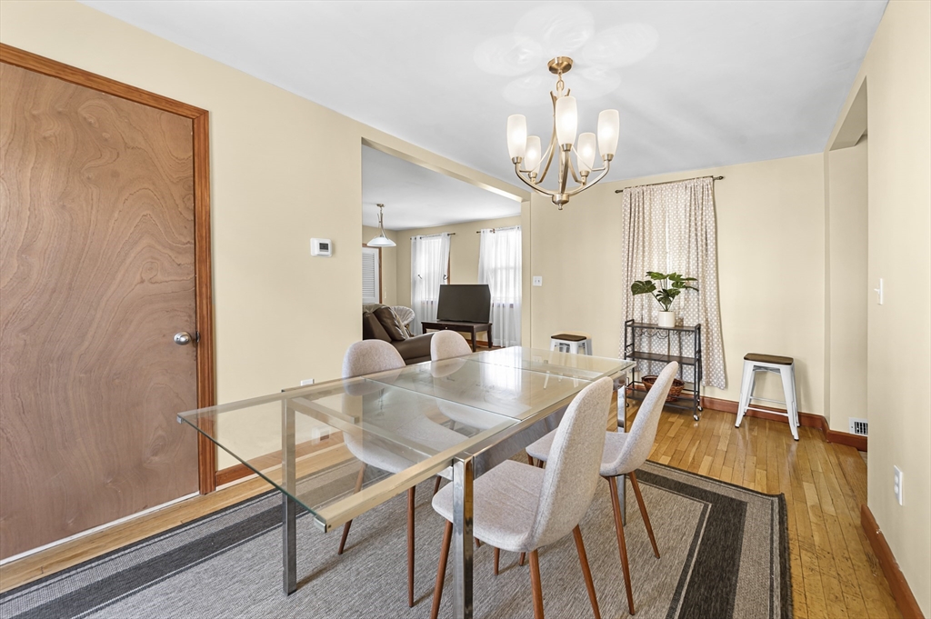 50 Temple Street, Unit 50 Somerville, MA 02145 - Photo 9 of 41 a view of a dining room with furniture and a chandelier