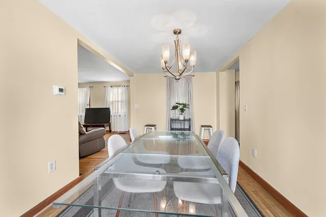 a view of a living room and chandelier