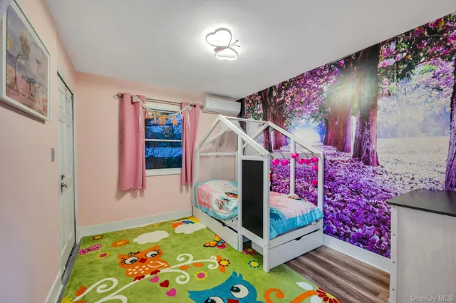 a bed room with furniture and a baby crib