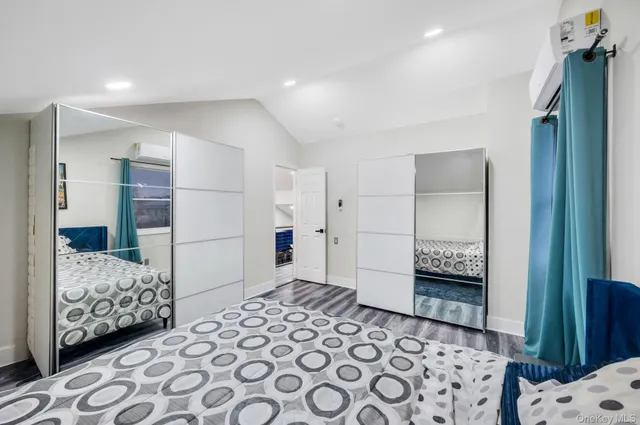 a bedroom with furniture and a baby crib