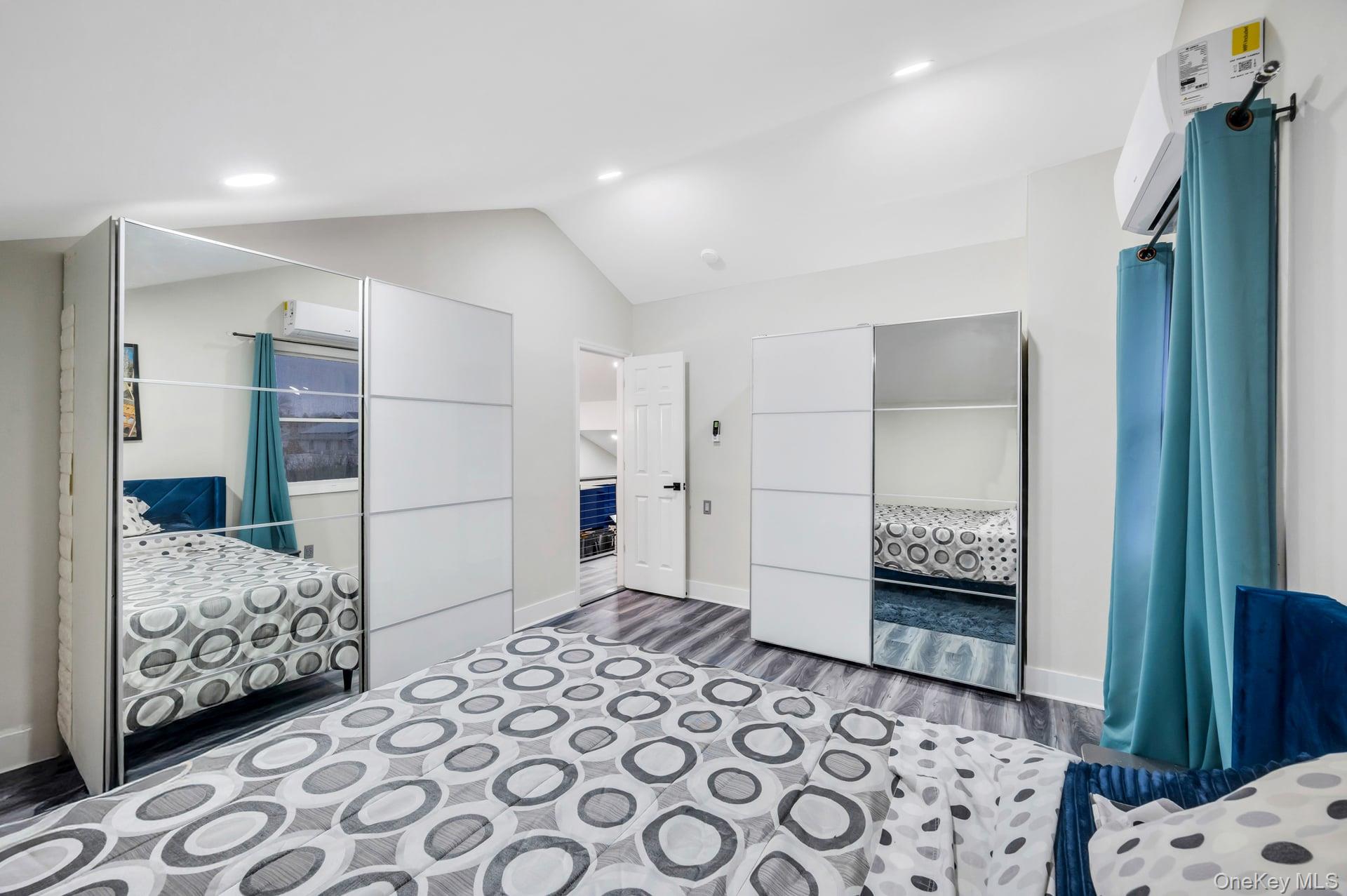 15 Drake Avenue Bellport, NY 11713 - Photo 15 of 20 a bedroom with furniture and a baby crib