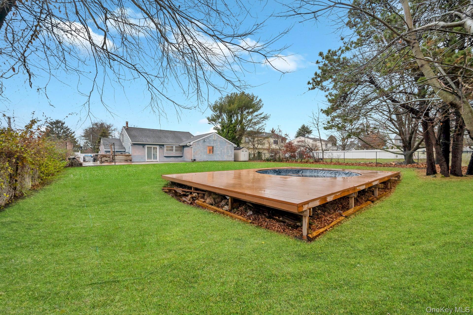 15 Drake Avenue Bellport, NY 11713 - Photo 17 of 20 a view of a backyard with a sitting area
