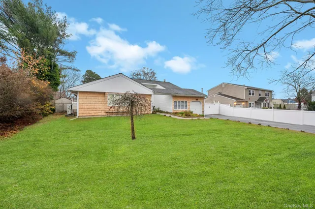 a view of a house with a backyard
