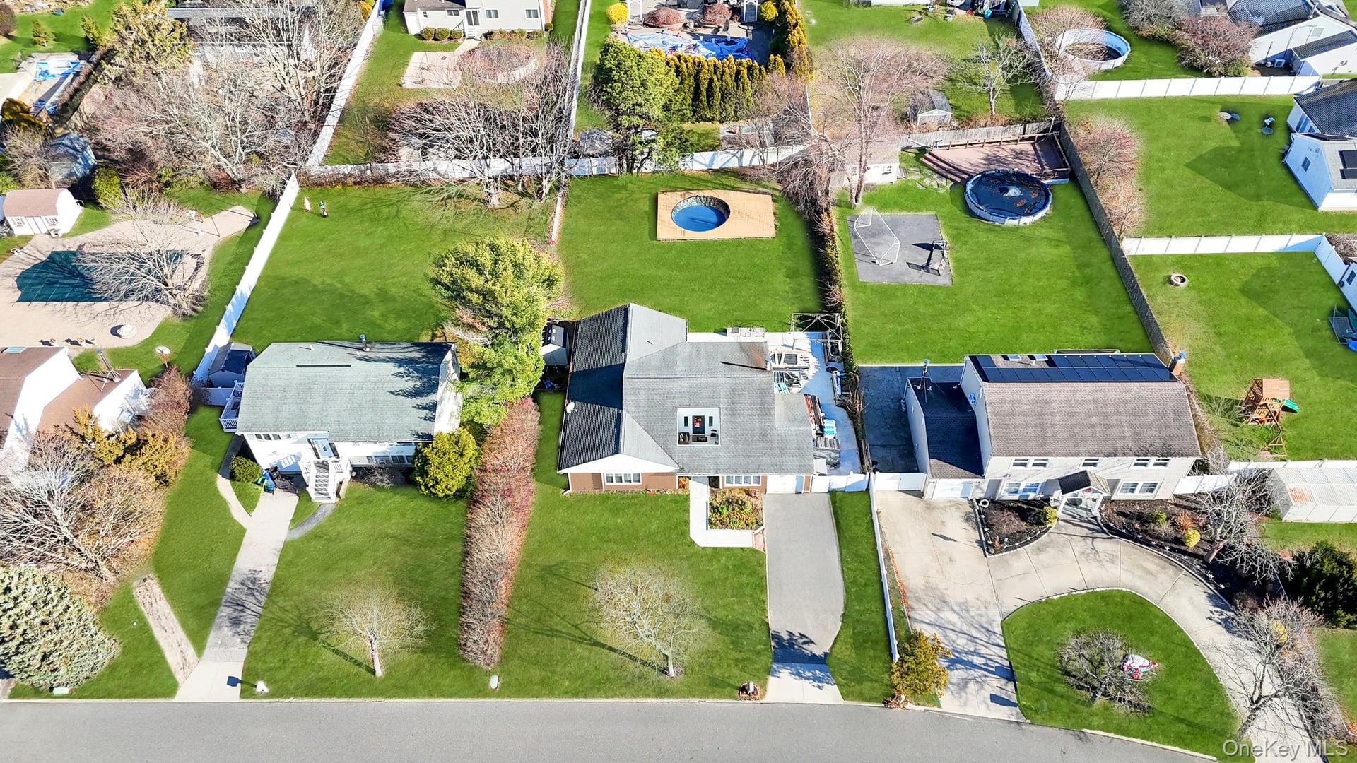 15 Drake Avenue Bellport, NY 11713 - Photo 19 of 20 an aerial view of a house with a swimming pool