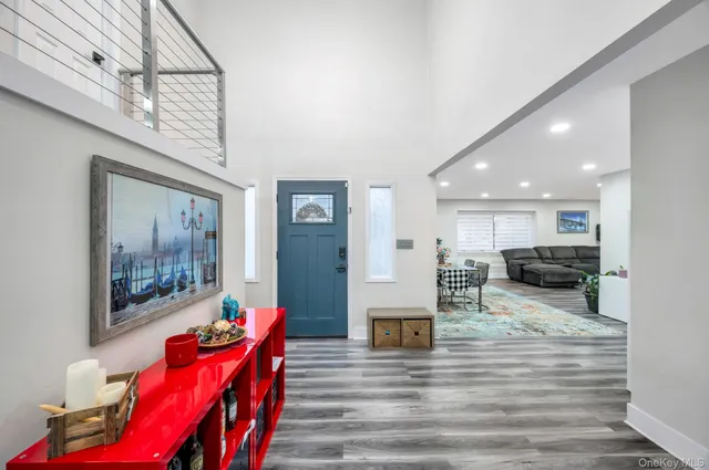 a living room with furniture or couch and a wooden floor