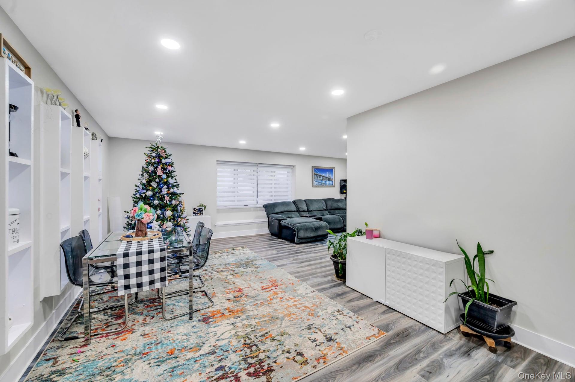 15 Drake Avenue Bellport, NY 11713 - Photo 4 of 20 a living room with furniture and a potted plant