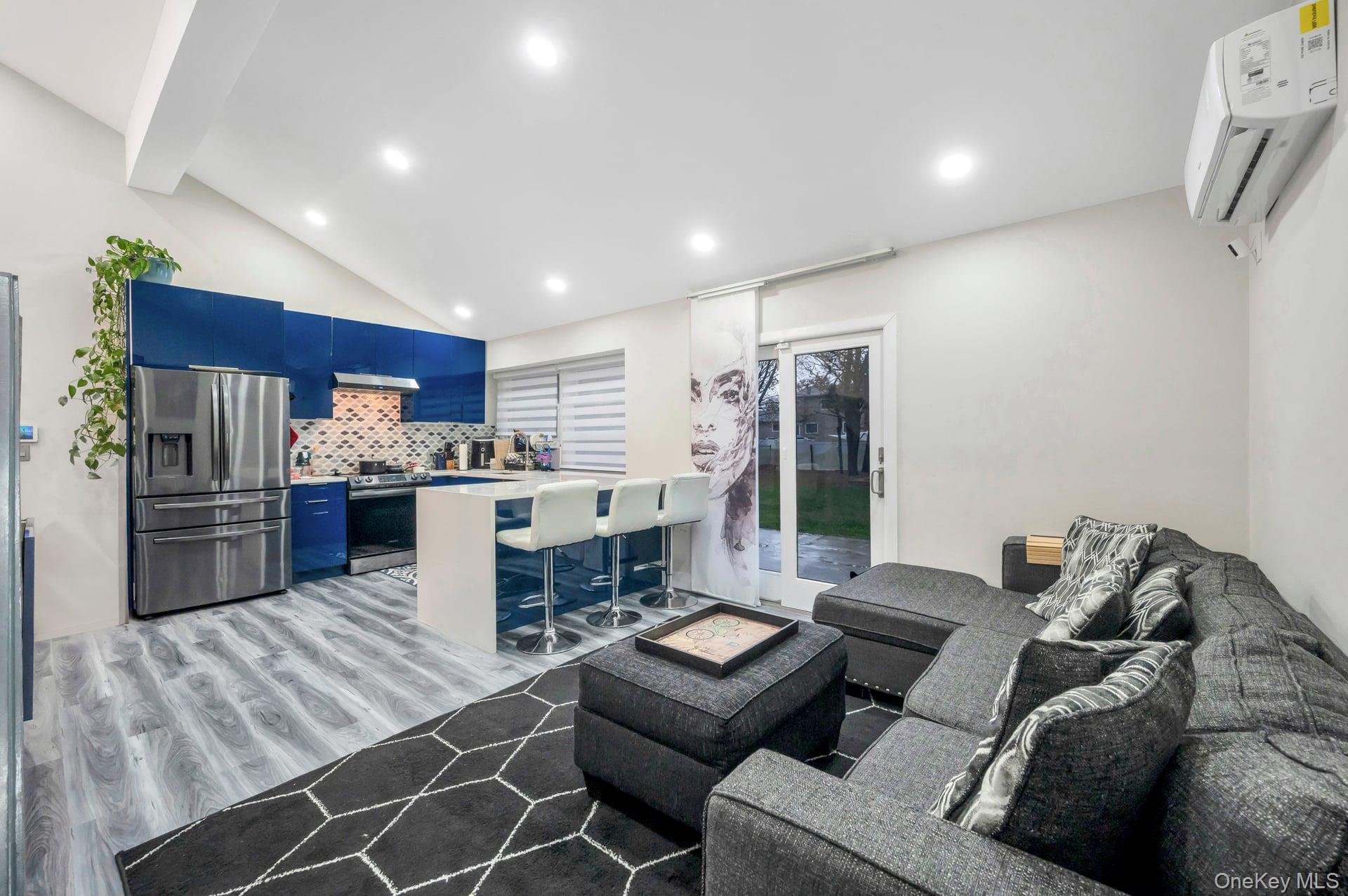 15 Drake Avenue Bellport, NY 11713 - Photo 9 of 20 a living room with furniture and kitchen view