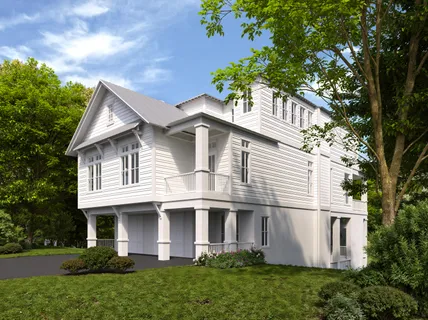 a view of a white house next to a yard with plants and trees