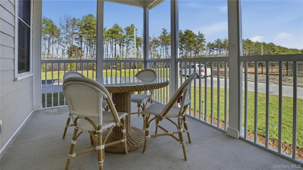 a view of a chairs and table in patio