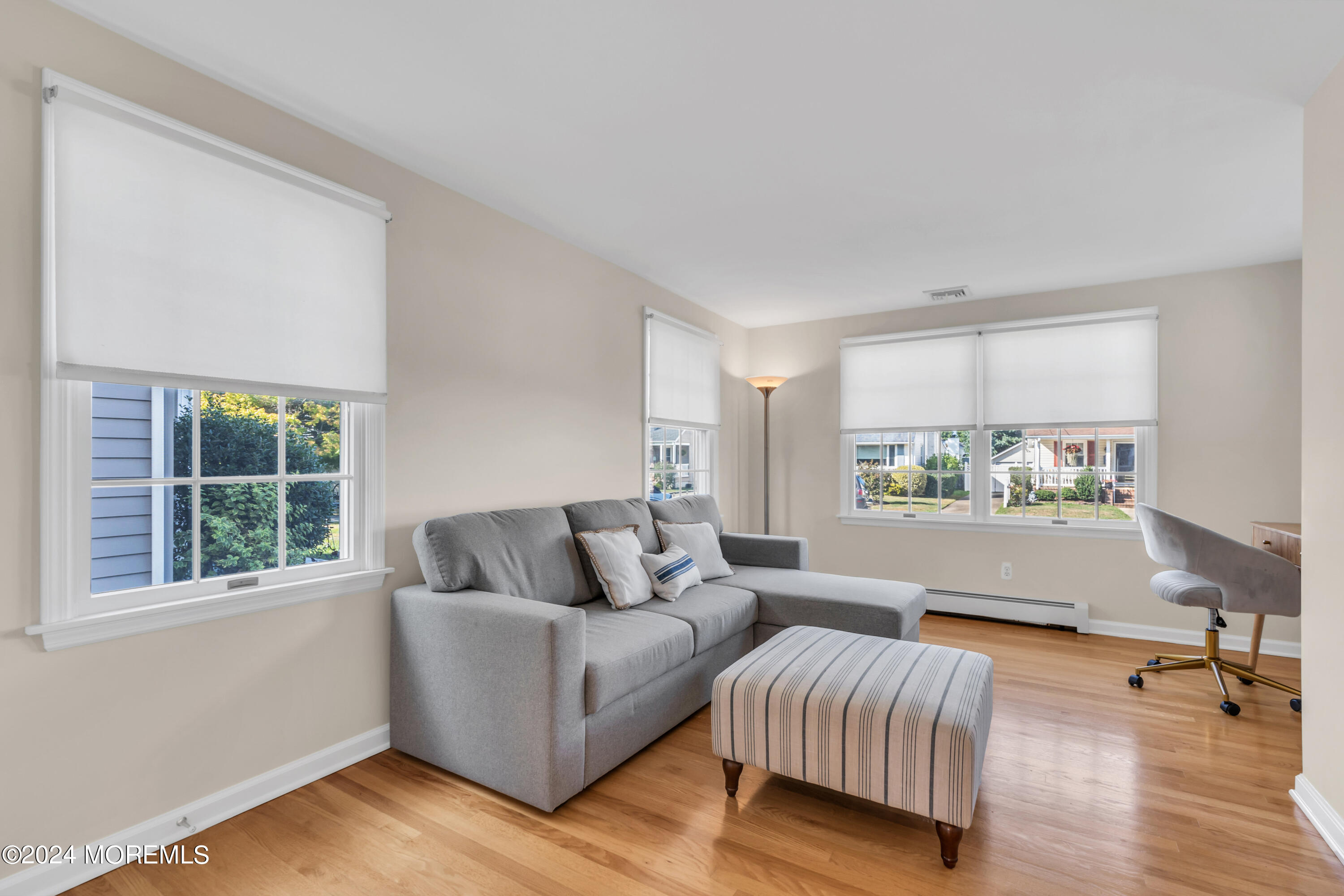 807 Prospect Avenue Spring Lake Heights, NJ 07762 - Photo 13 of 27 a living room with furniture and a large window