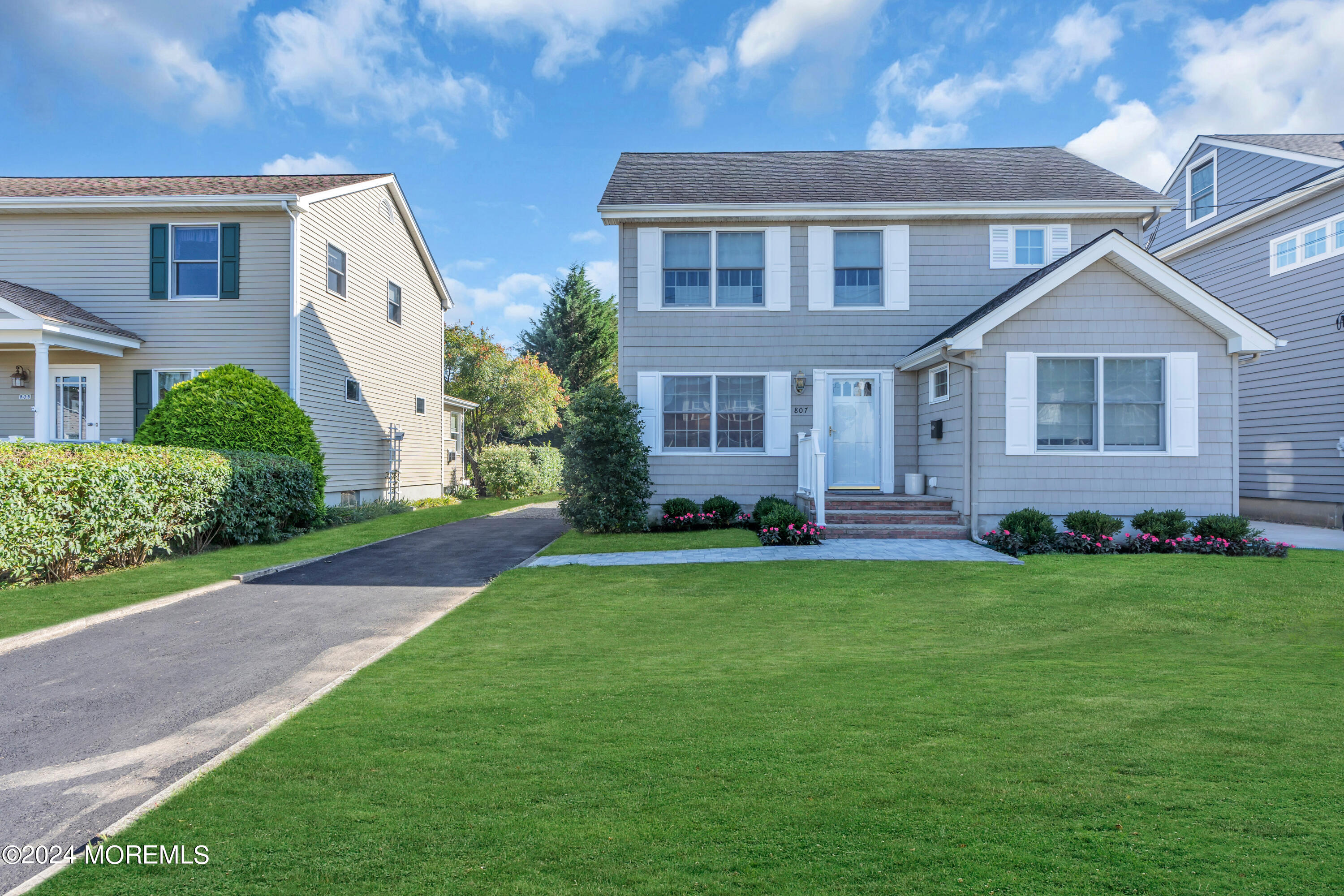 807 Prospect Avenue Spring Lake Heights, NJ 07762 - Photo 2 of 27 a front view of a house with a yard