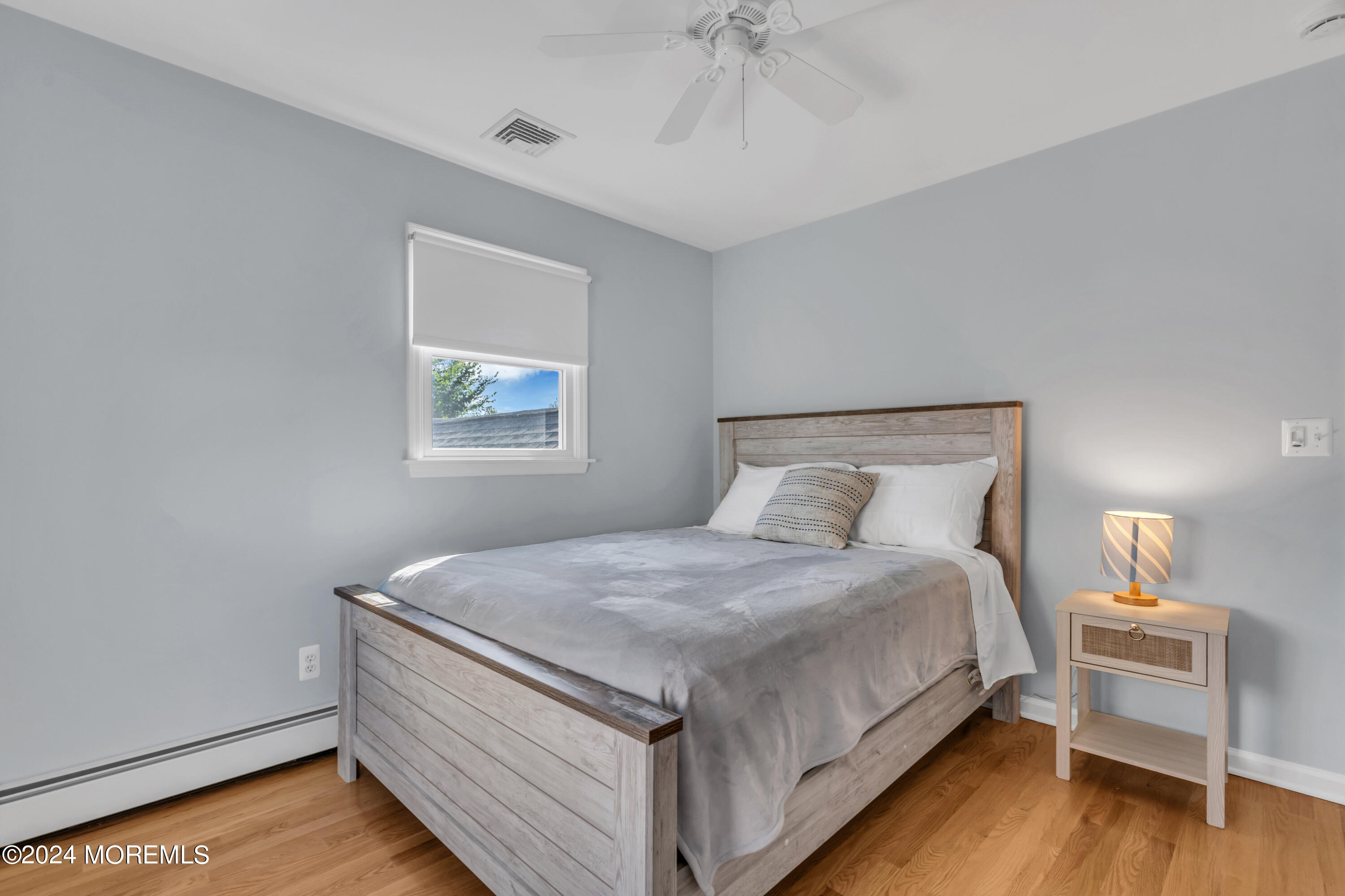 807 Prospect Avenue Spring Lake Heights, NJ 07762 - Photo 22 of 27 a bedroom with a bed and a window