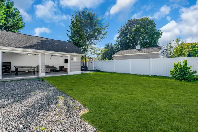 a view of a backyard with sitting area