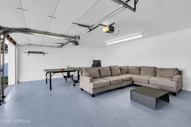 a living room with furniture and a table