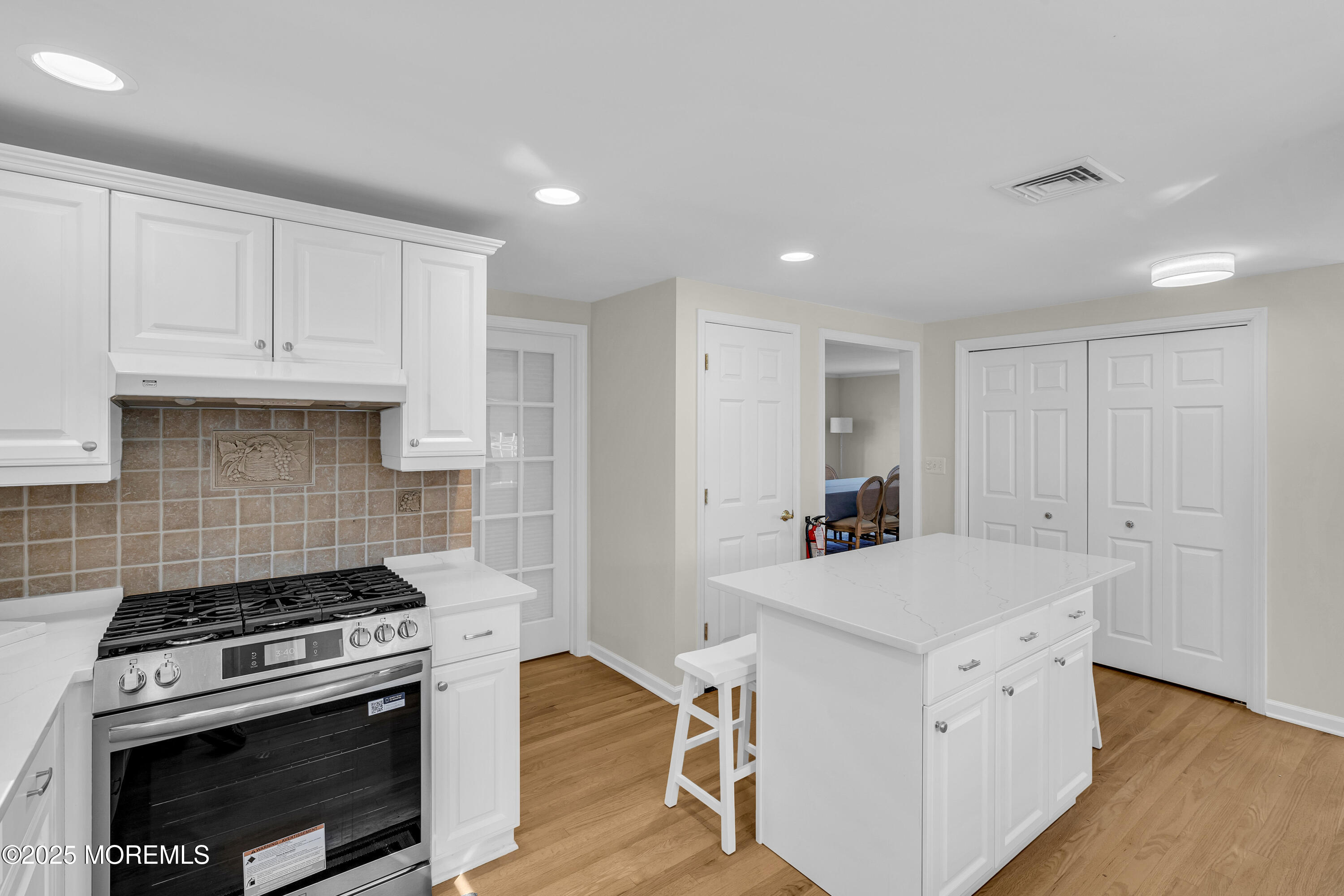 807 Prospect Avenue Spring Lake Heights, NJ 07762 - Photo 8 of 27 a kitchen with a stove and a microwave