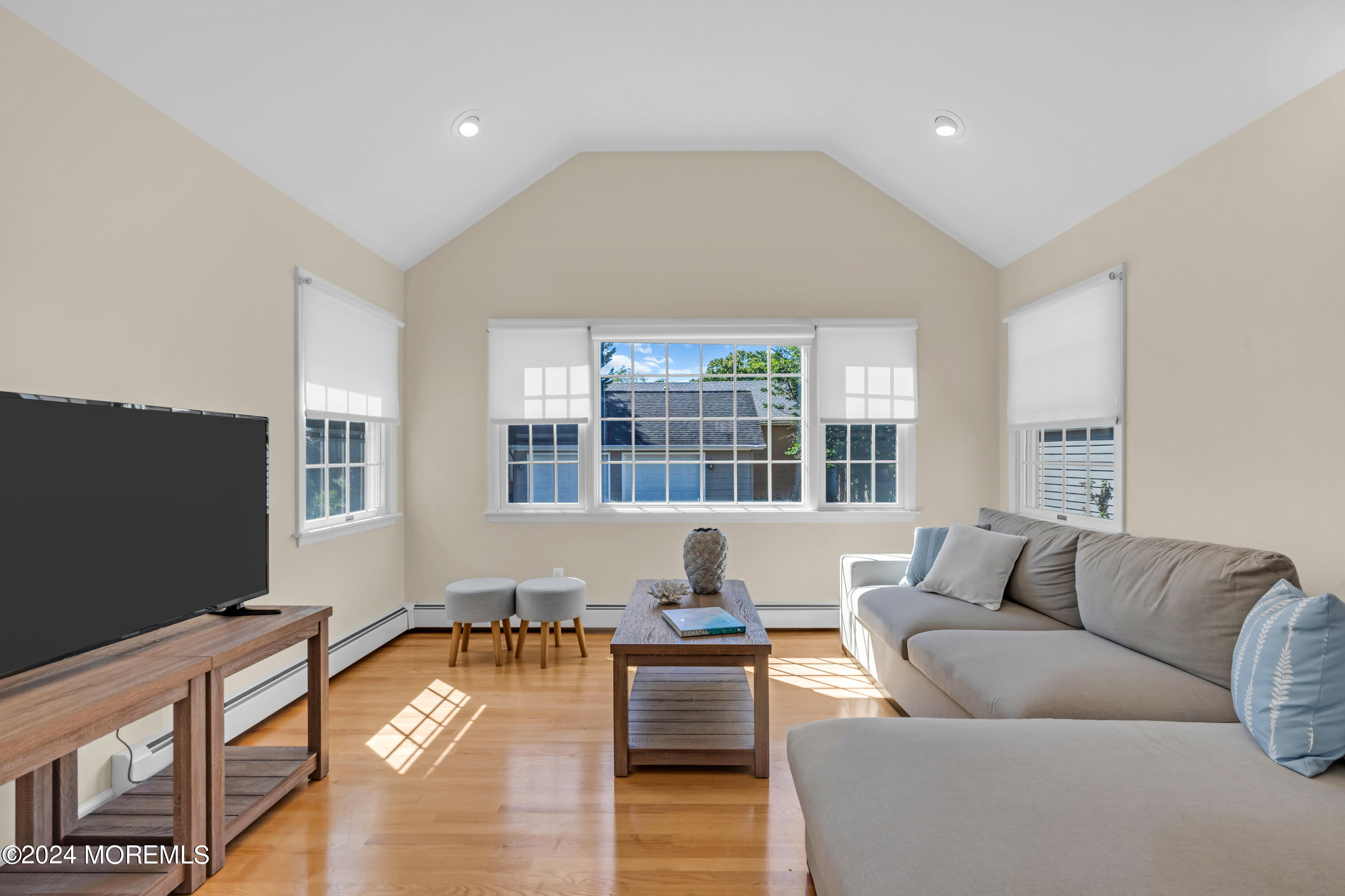 807 Prospect Avenue Spring Lake Heights, NJ 07762 - Photo 10 of 27 a living room with furniture and a flat screen tv