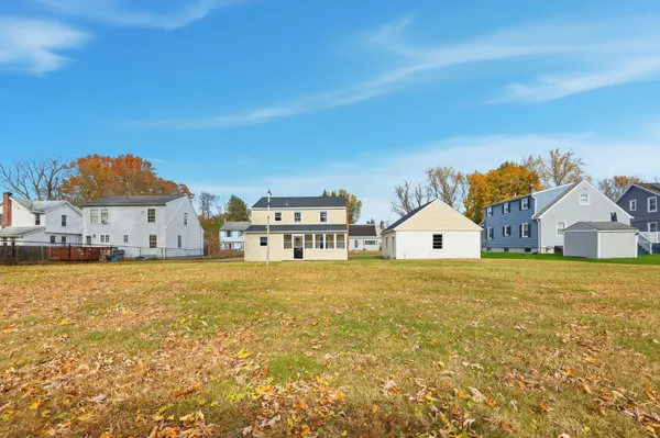 a view of a swimming pool with a yard