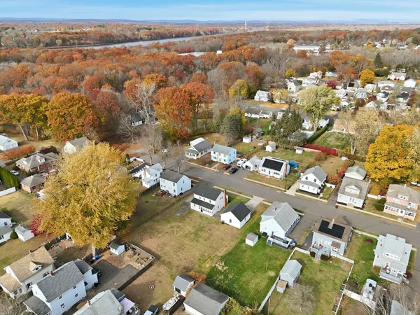 an aerial view of residential building with parking