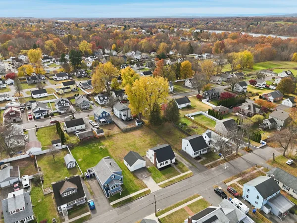 an aerial view of residential houses with outdoor space