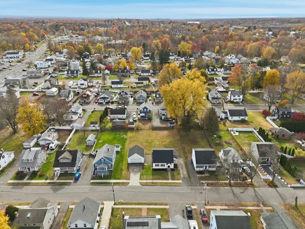 an aerial view of residential houses with outdoor space