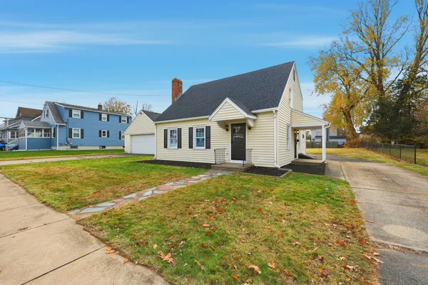 a view of a house with swimming pool and yard