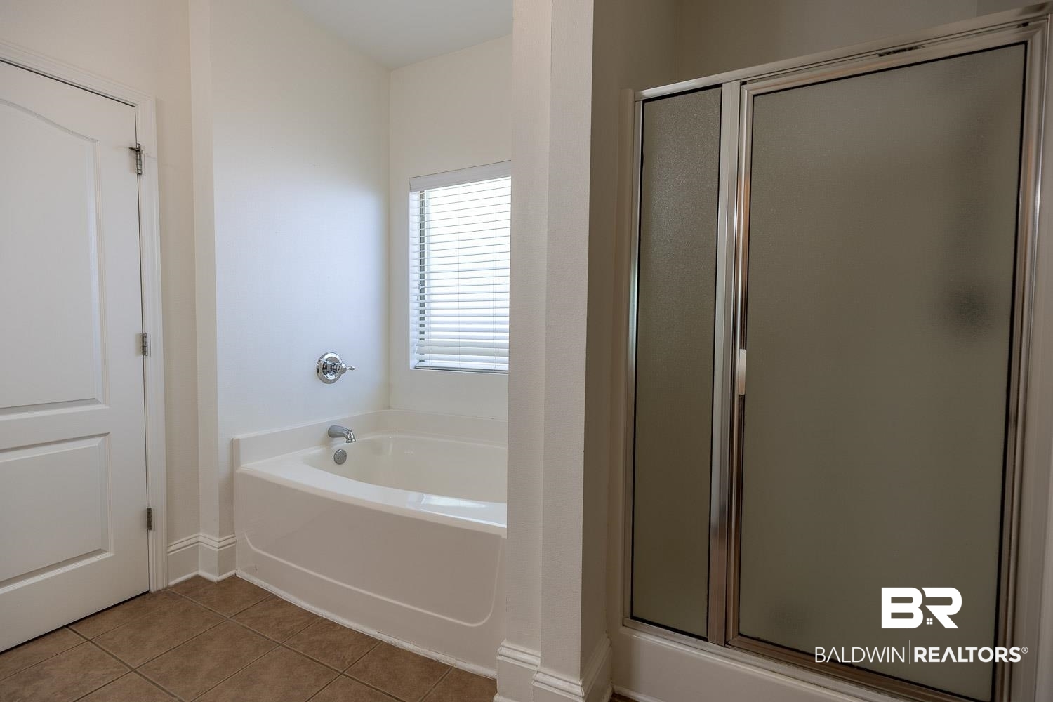 101 Normandy Street Fairhope, AL 36532 - Photo 12 of 18 Full bathroom with a stall shower, tile patterned floors, and a bath