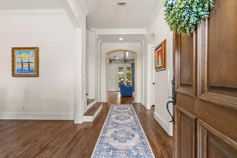 wooden floor in a gallery with a mirror