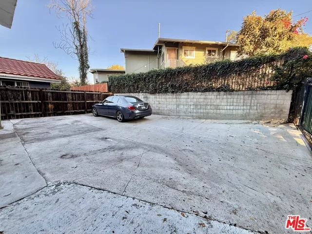 a view of parking space in front of residential houses