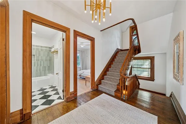 a view of an entryway with wooden floor and windows