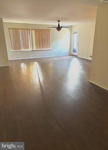 a view of a livingroom with wooden floor