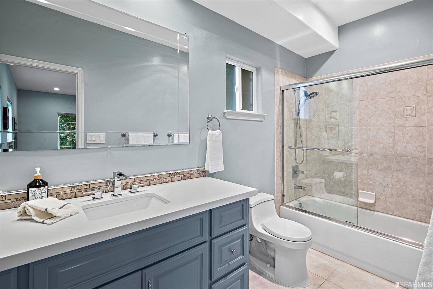 6700 Moore Drive Oakland, CA 94611 - Photo 22 of 44 a bathroom with a sink toilet vanity tub and shower