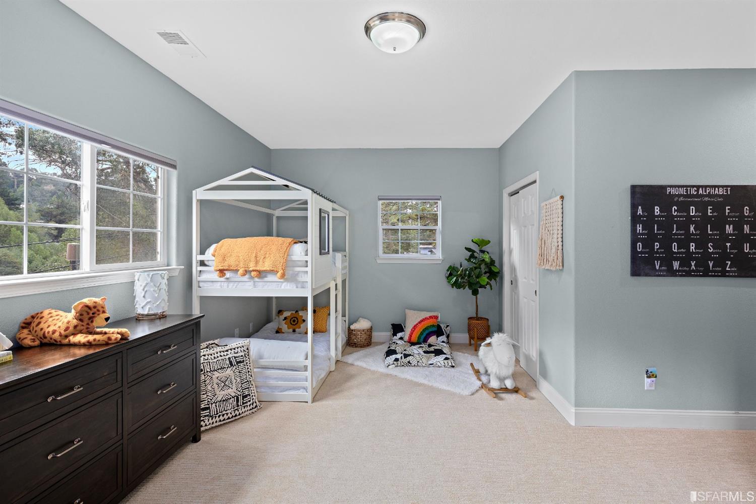 6700 Moore Drive Oakland, CA 94611 - Photo 26 of 44 a bedroom with furniture and a window