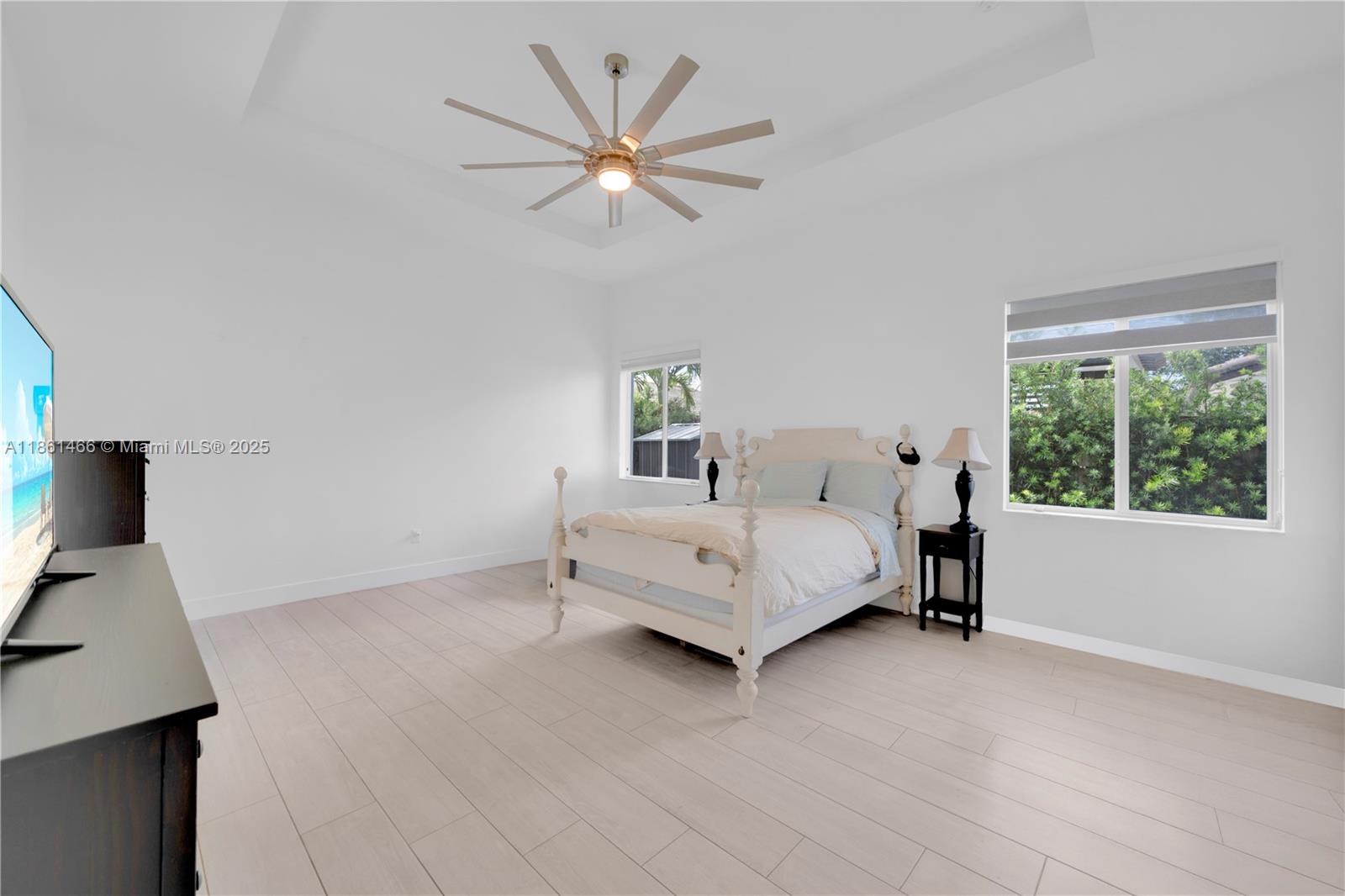 15012 Southwest 177th Terrace Miami, FL 33187 - Photo 13 of 16 a bedroom with a bed and a window