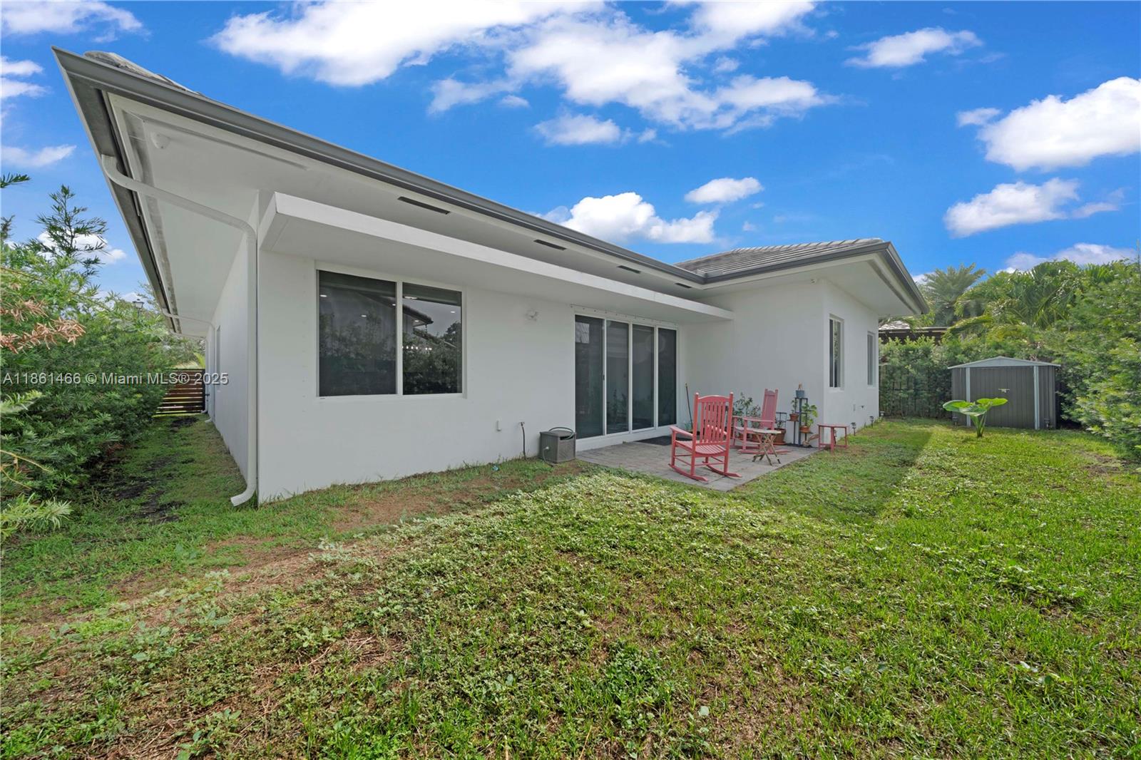 15012 Southwest 177th Terrace Miami, FL 33187 - Photo 16 of 16 a view of a porch in front of a house